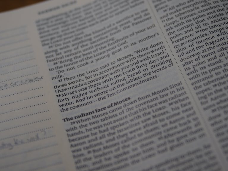 A detailed view of a Bible page focusing on Exodus scripture text.