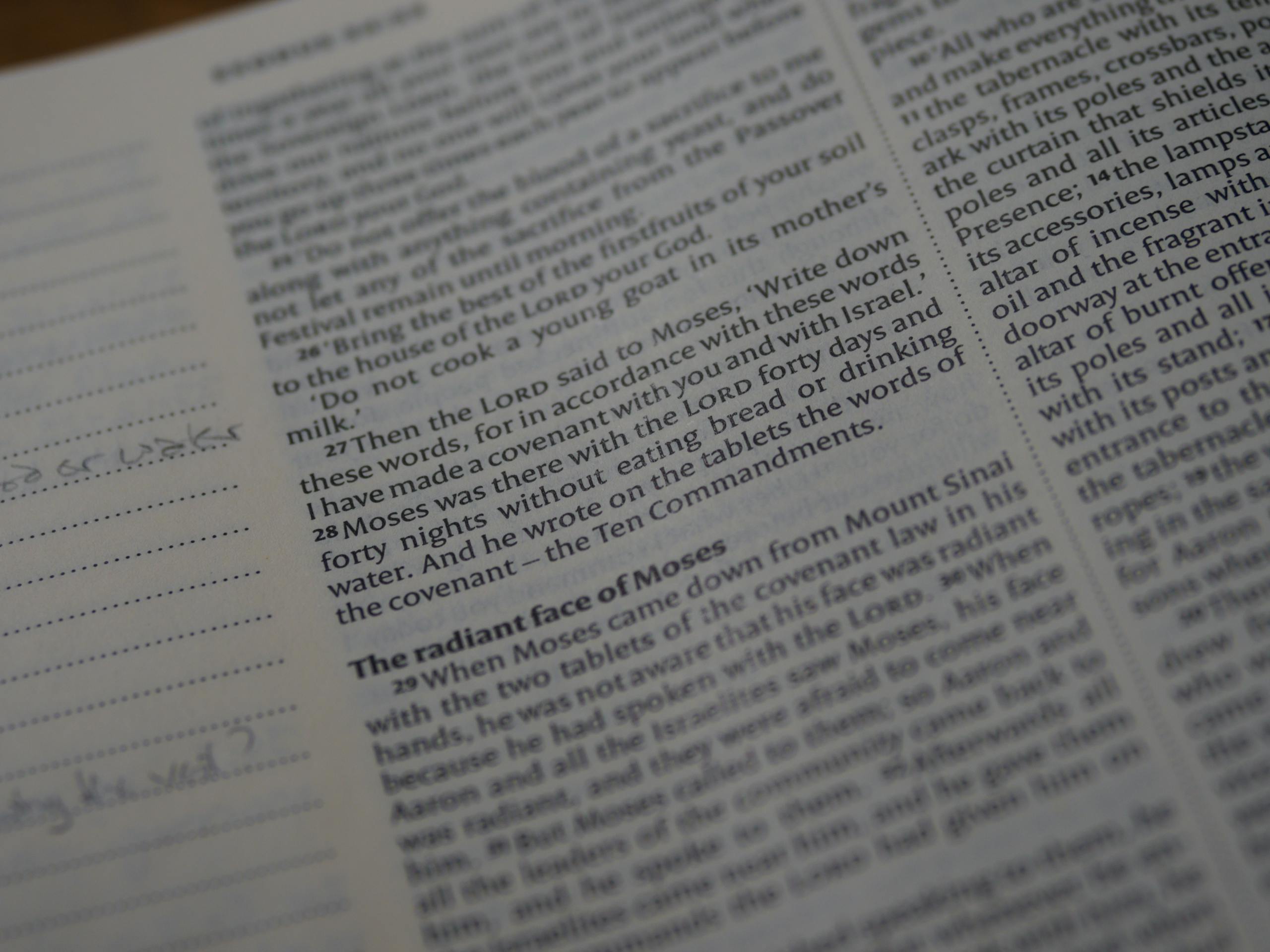 A detailed view of a Bible page focusing on Exodus scripture text.